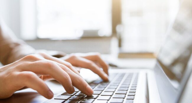 Typing on laptop Typing on laptop